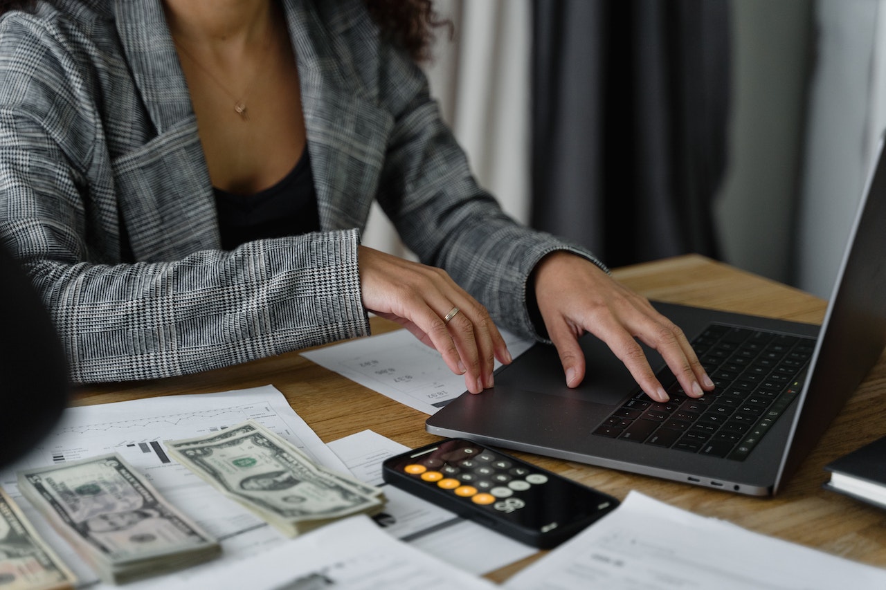 Woman working out her tax savings on a computer